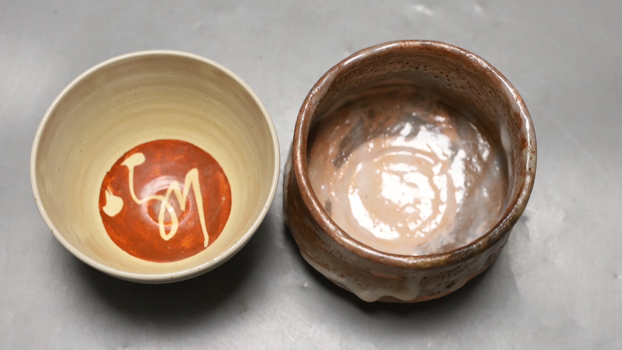 Two Japanese studio pottery chawan tea bowls, one with raku glaze, 12cm diameter